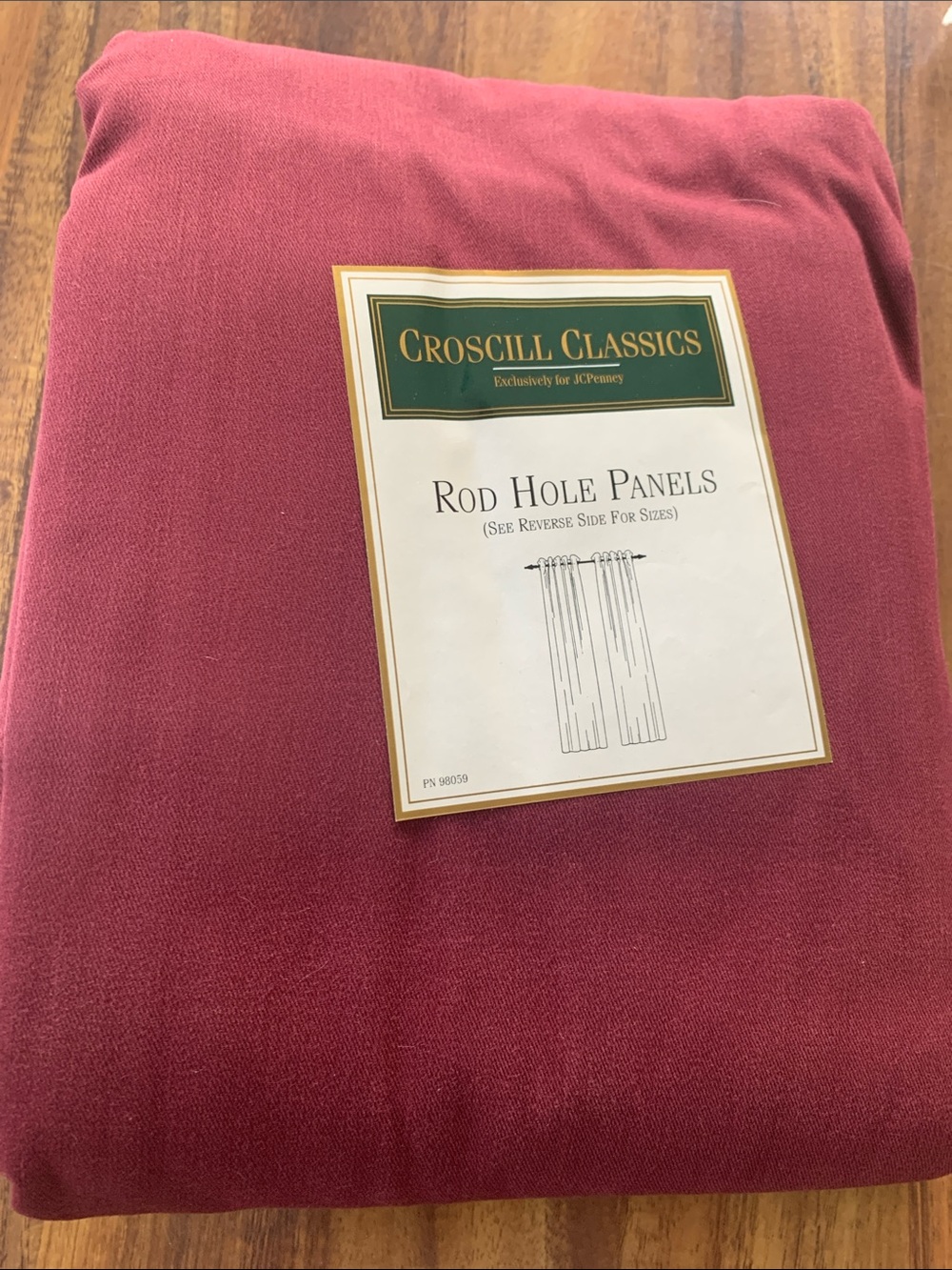 One pair of Rod Hole Curtain Panels in Burgundy (sold as a pair)!